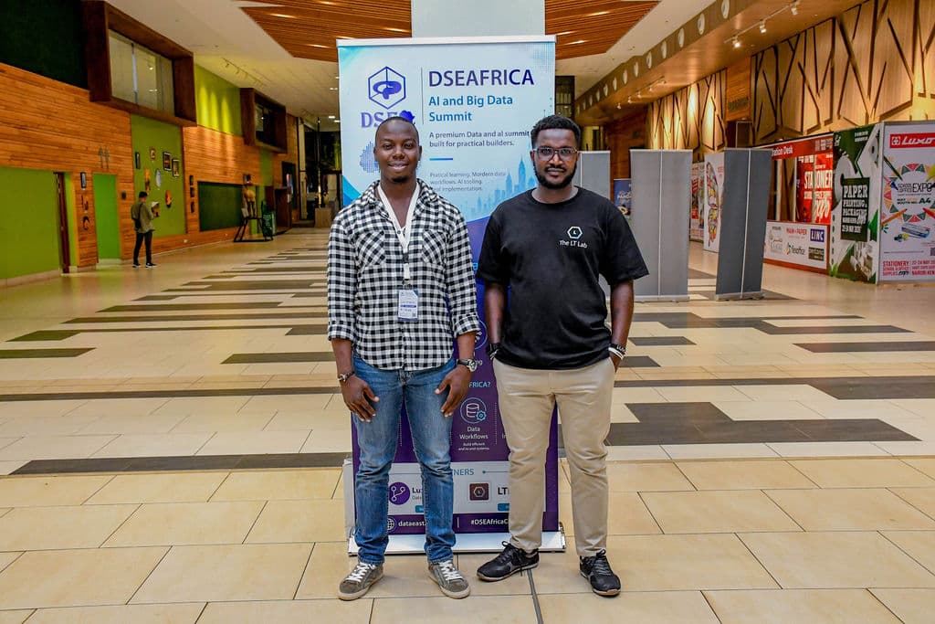 Two attendees talking in the Sarit Expo Centre concourse