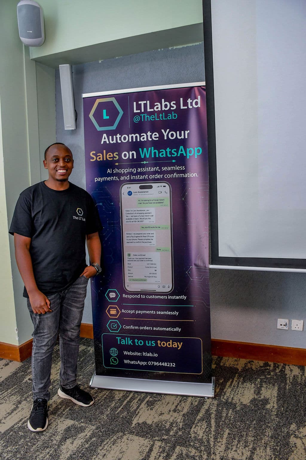 An attendee by a partner stand during the summit